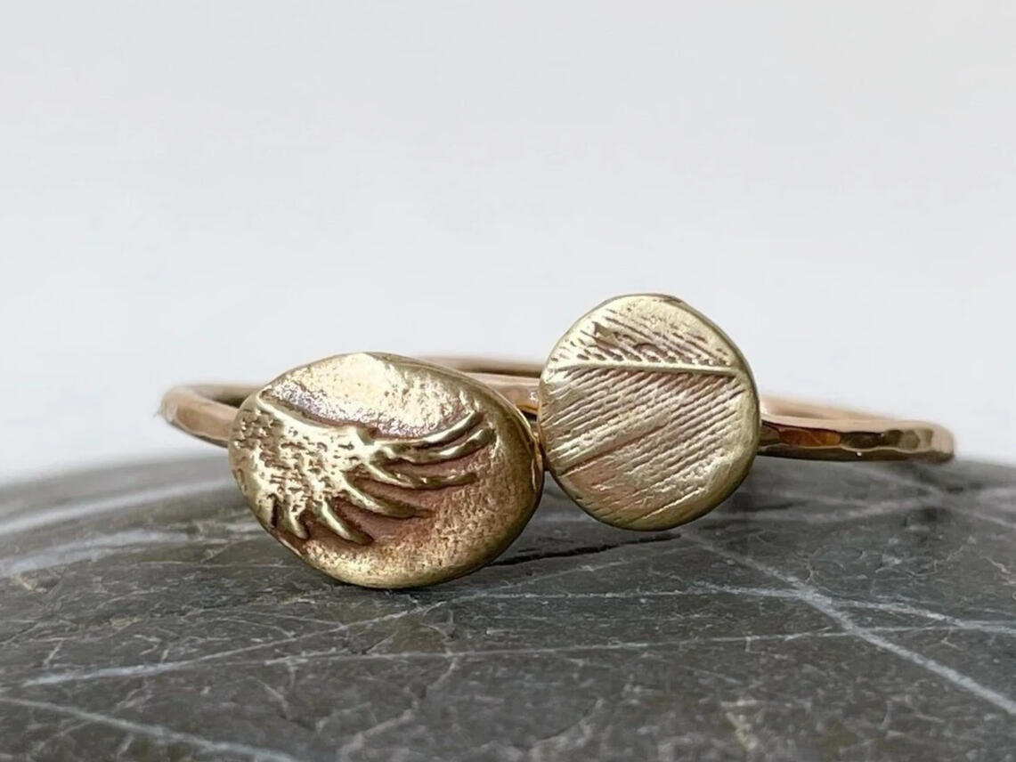 Wing ring sculpted from the silhouette of my crow friend's actual majestic flapper; Feather ring sculpted from a mold of one of his gently molted wing feathers.